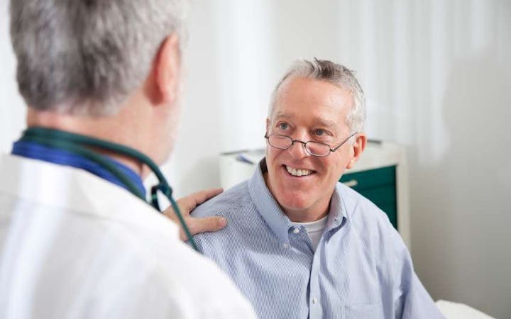 doctor in patient room.