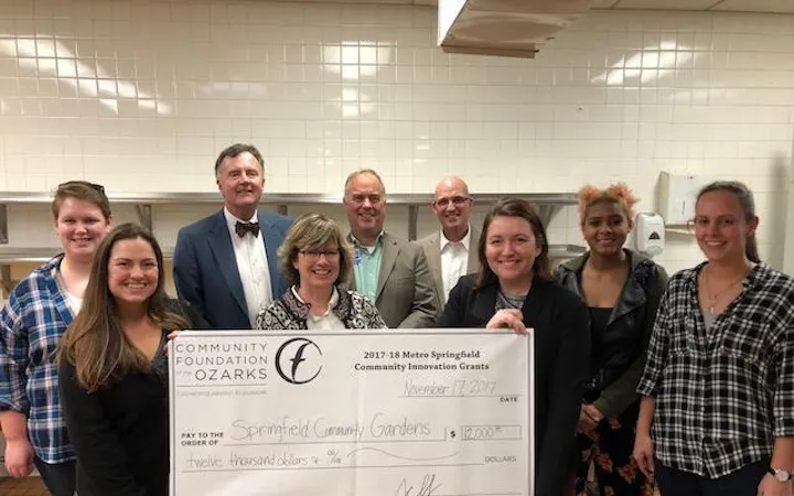 Community Foundation of the Ozarks presents a check to Springfield Community Gardens.