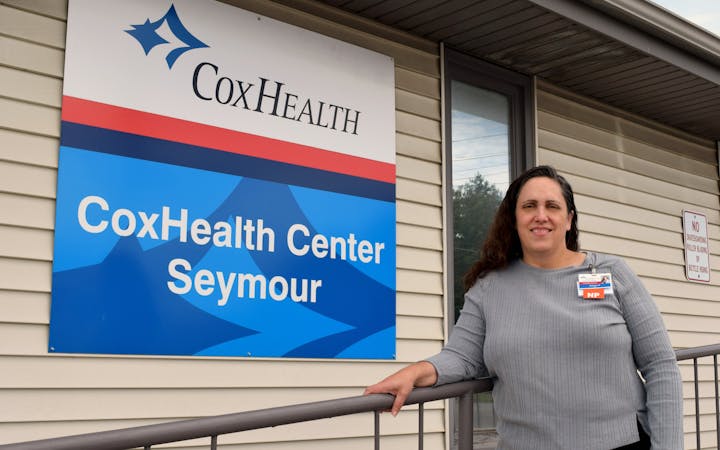 Jeanne Rodman stands in front of CoxHealth Center Seymour.