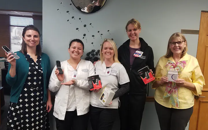 CoxHealth representatives drop off phones at The Victim Center.