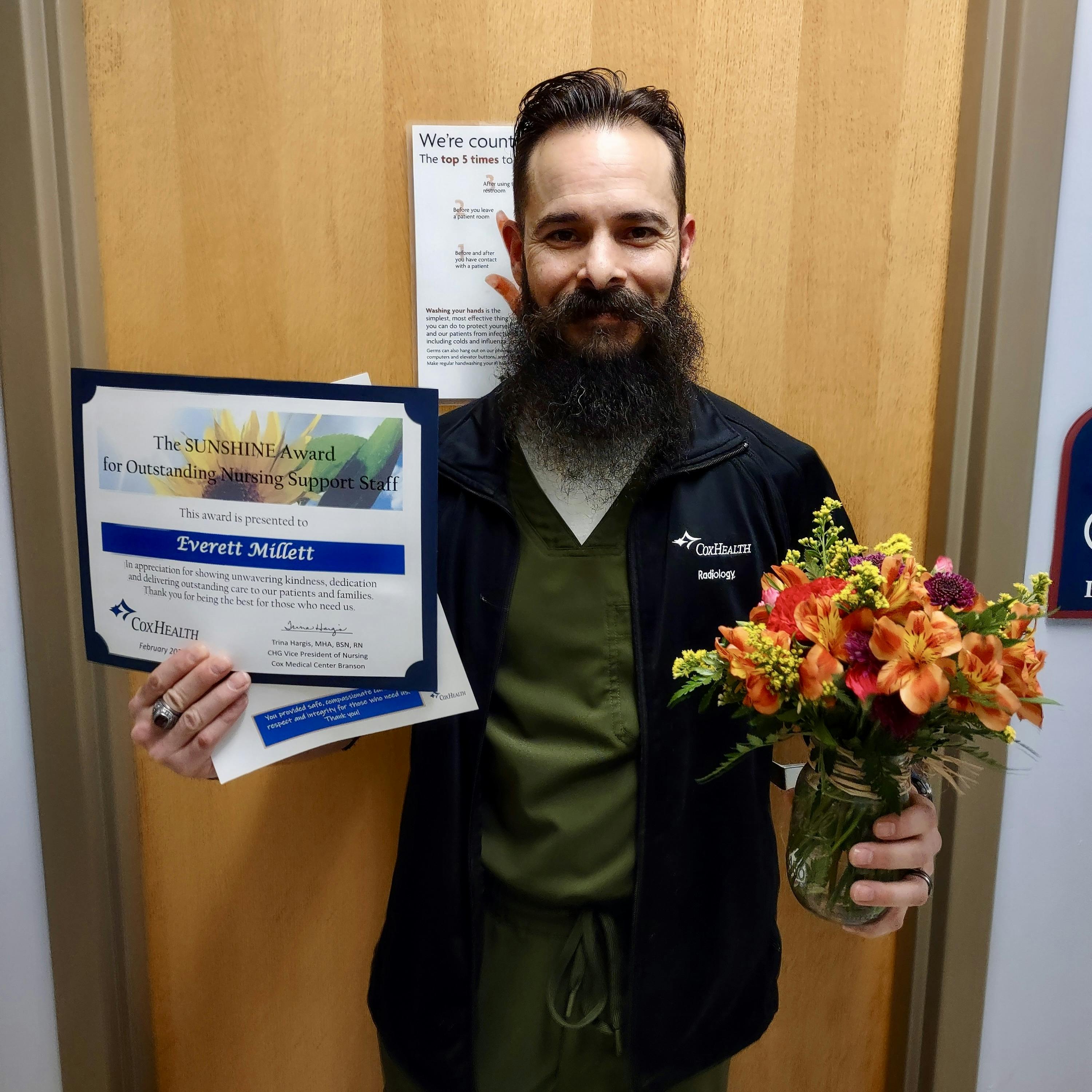 Everett Millett displays his CoxHealth Sunshine Award.