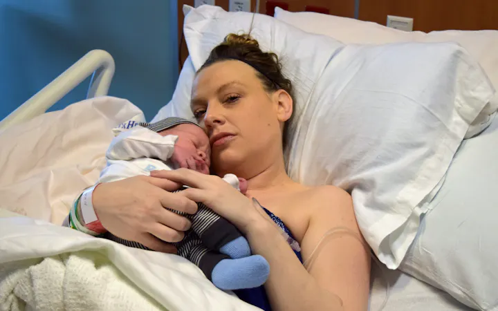 Darcy Wilson holds her new baby, Waylon.