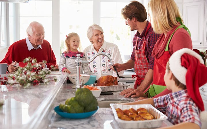 Family in the kitchen enjoying a festive dinner
