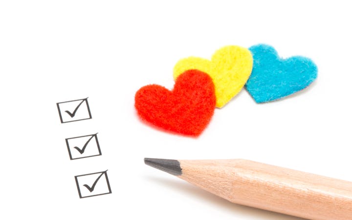 A pencil is pictured next to some "checked" boxes.