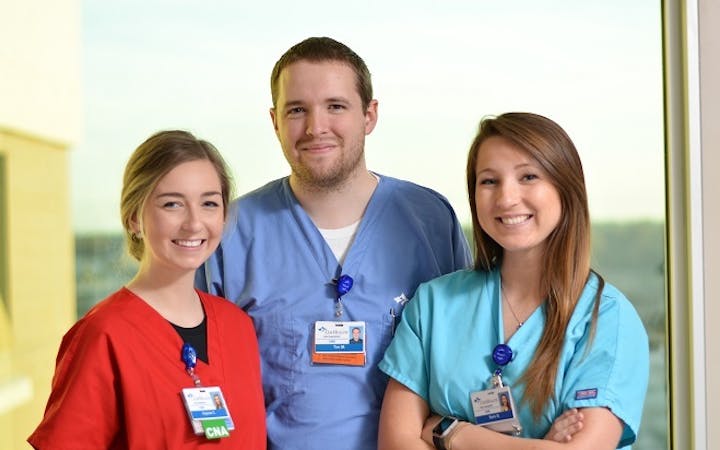 A group of employees poses for the camera.