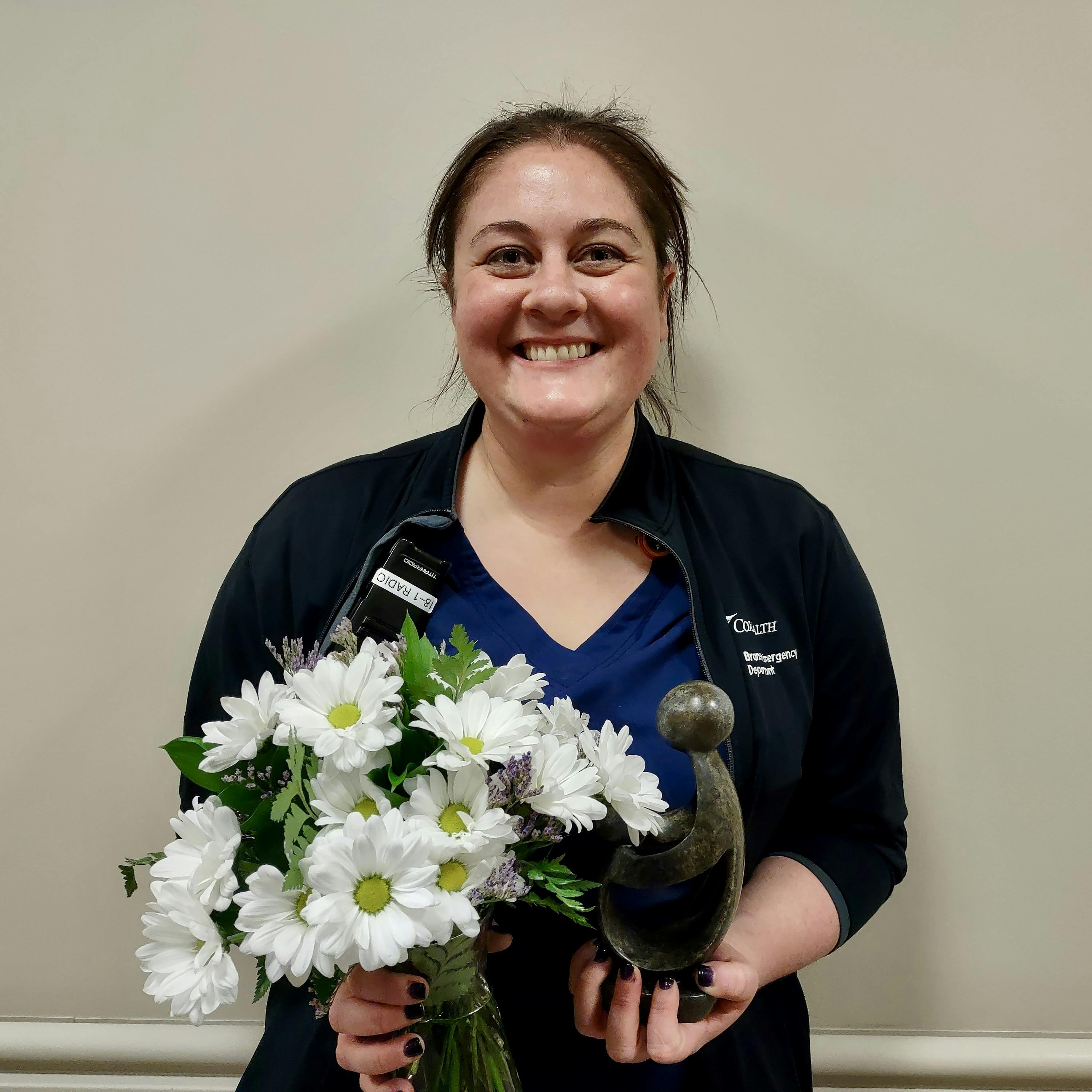 Patty Morris-Brothers displays her DAISY Award.