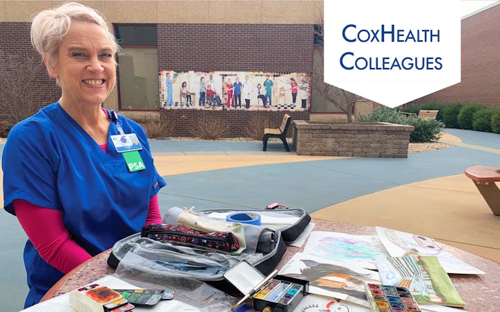 CoxHealth PSA Elisa Kruger sits with her paintings