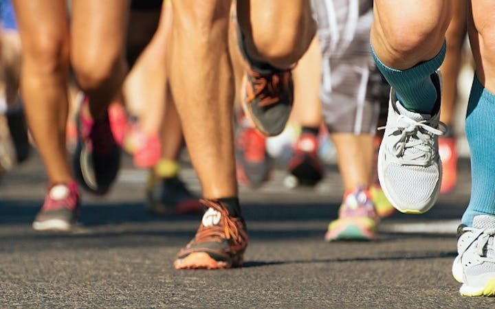 people running on road